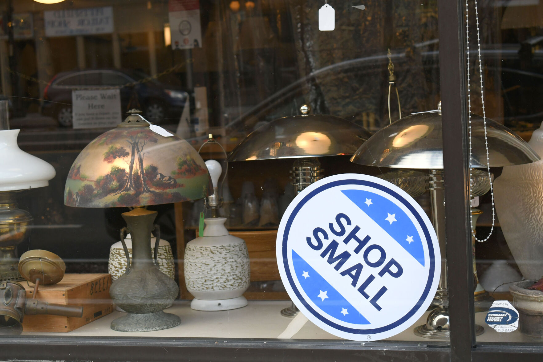 A shop small sign in a shop window